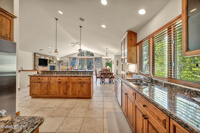 886 Rosewood Cir, Incline Village, NV 89451 - kitchen featuring a sink, stainless steel appliances, lofted ceiling, open floor plan, and dark stone countertops