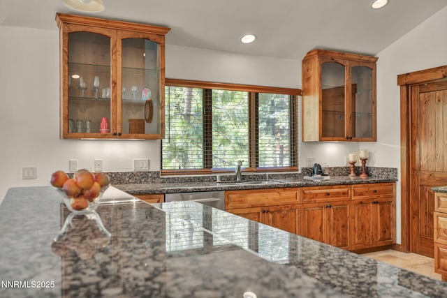 886 Rosewood Cir, Incline Village, NV 89451 - kitchen with dishwasher, a sink, dark stone counters, glass insert cabinets, and recessed lighting