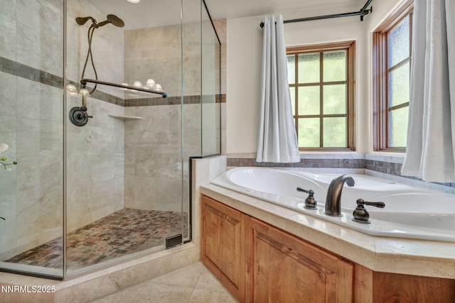 886 Rosewood Cir, Incline Village, NV 89451 - bathroom with a stall shower, a garden tub, and tile patterned floors