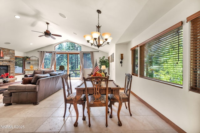 886 Rosewood Cir, Incline Village, NV 89451 - dining space featuring vaulted ceiling, a ceiling fan, baseboards, a chandelier, and a stone fireplace