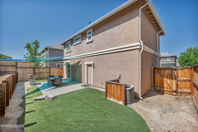 3678 Hollywood Park Dr, Reno, NV 89512 - back of property with a patio area, stucco siding, and a gate