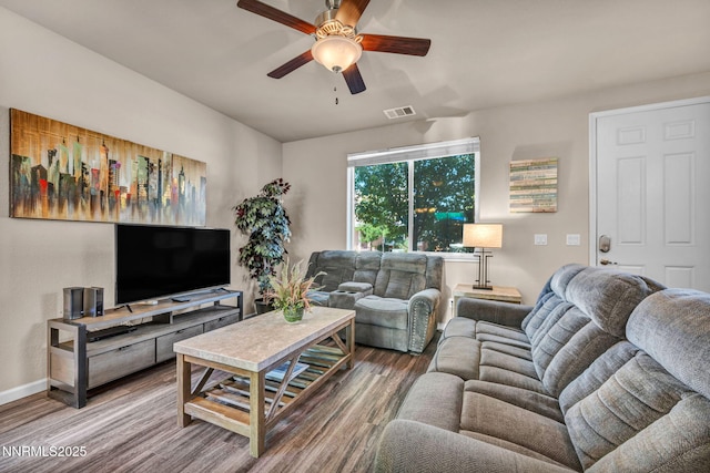 3678 Hollywood Park Dr, Reno, NV 89512 - living area featuring a ceiling fan, wood finished floors, and baseboards