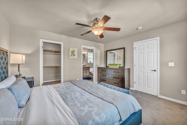 3678 Hollywood Park Dr, Reno, NV 89512 - carpeted bedroom featuring baseboards, ceiling fan, ensuite bath, and a closet