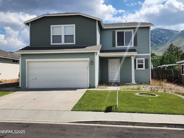 7890 Key Largo Dr, Reno, NV 89506 - traditional-style home featuring driveway, an attached garage, and a mountain view