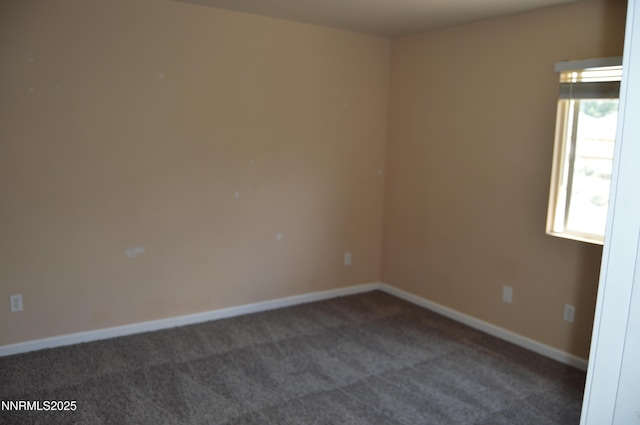 7890 Key Largo Dr, Reno, NV 89506 - spare room featuring dark colored carpet and baseboards
