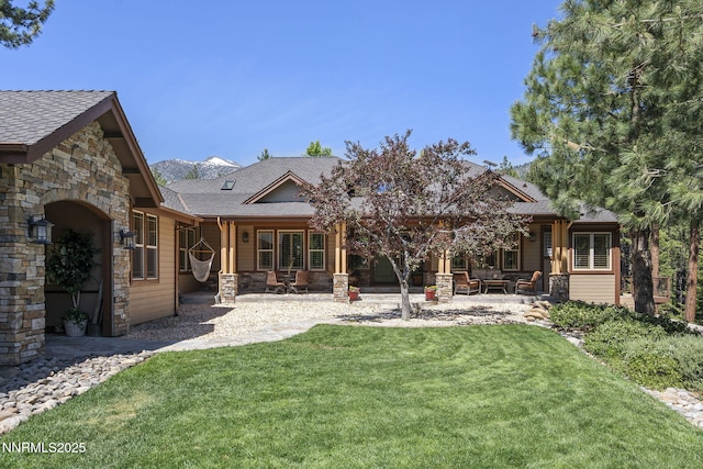165 Piney Creek Rd, Reno, NV 89511 - back of property with stone siding, a lawn, and a shingled roof