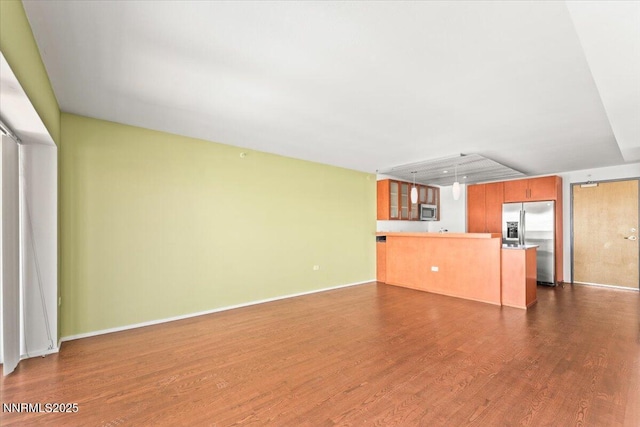 255 N Sierra St Unit 1709, Reno, NV 89501 - unfurnished living room featuring dark wood-type flooring and baseboards