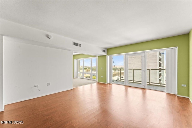 255 N Sierra St Unit 1709, Reno, NV 89501 - spare room with wood finished floors and baseboards