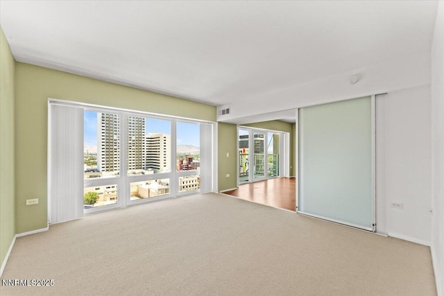 255 N Sierra St Unit 1709, Reno, NV 89501 - carpeted spare room featuring baseboards