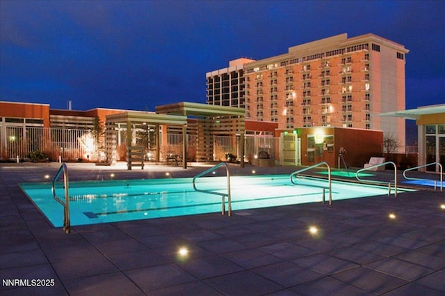255 N Sierra St Unit 1709, Reno, NV 89501 - pool at twilight with a community pool and a patio area