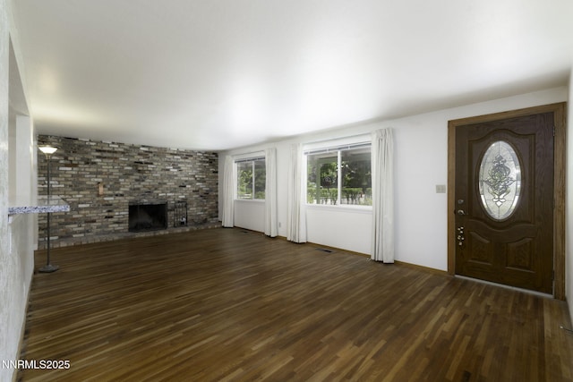 4879 Idlewild Dr, Reno, NV 89519 - entrance foyer featuring dark wood-style floors and a brick fireplace