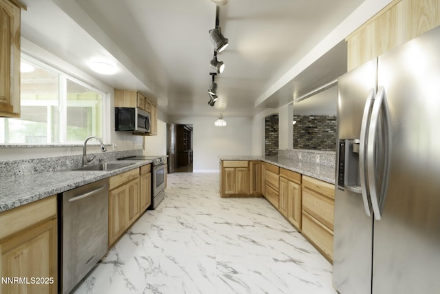 4879 Idlewild Dr, Reno, NV 89519 - kitchen featuring appliances with stainless steel finishes, light marble finish floors, light stone counters, rail lighting, and light brown cabinets