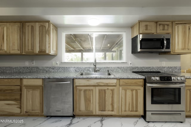 4879 Idlewild Dr, Reno, NV 89519 - kitchen featuring stainless steel appliances, light brown cabinetry, light marble finish flooring, and light stone countertops