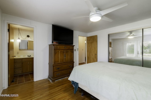 4879 Idlewild Dr, Reno, NV 89519 - bedroom featuring wood finished floors, a closet, ensuite bath, and ceiling fan