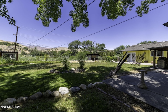 4879 Idlewild Dr, Reno, NV 89519 - view of grassy yard featuring a patio