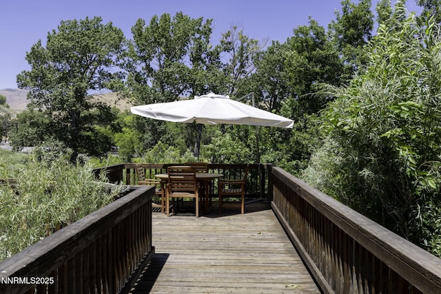 4879 Idlewild Dr, Reno, NV 89519 - wooden deck featuring outdoor dining area
