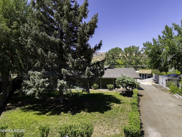 4879 Idlewild Dr, Reno, NV 89519 - view of property hidden behind natural elements featuring driveway