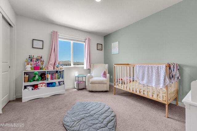 503 Astraea Trl, Reno, NV 89506 - bedroom with carpet, a crib, a closet, and baseboards