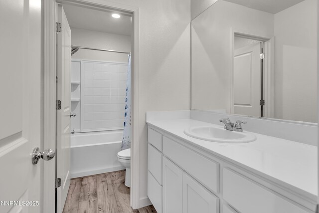 503 Astraea Trl, Reno, NV 89506 - full bathroom featuring vanity, toilet, wood finished floors, and shower / tub combo with curtain