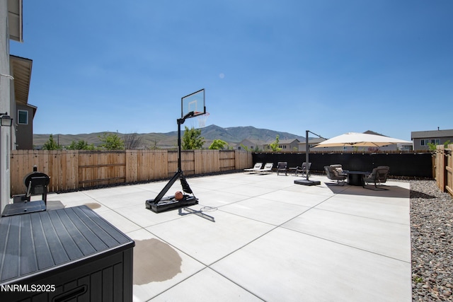 503 Astraea Trl, Reno, NV 89506 - fenced backyard featuring a mountain view and a patio