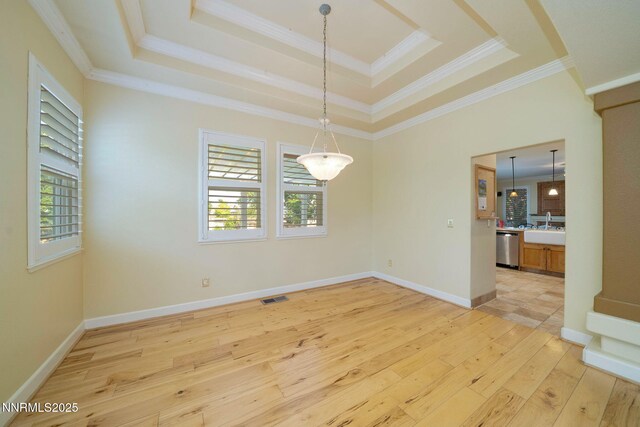 6978 Poco Bueno Cir, Sparks, NV 89436 - spare room featuring a raised ceiling, light wood finished floors, a sink, crown molding, and baseboards