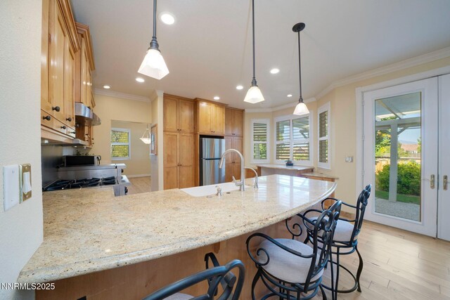 6978 Poco Bueno Cir, Sparks, NV 89436 - kitchen with a peninsula, stove, crown molding, healthy amount of natural light, and recessed lighting