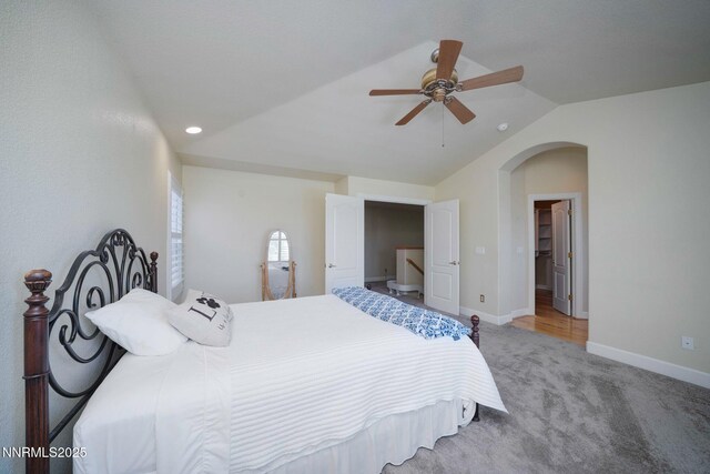 6978 Poco Bueno Cir, Sparks, NV 89436 - carpeted bedroom featuring vaulted ceiling, arched walkways, baseboards, a ceiling fan, and recessed lighting