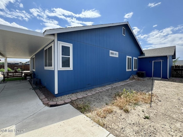 602 Tamsen Rd, Fernley, NV 89408 - view of side of home with central AC unit and a patio area