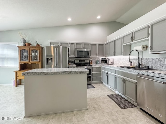 602 Tamsen Rd, Fernley, NV 89408 - kitchen with stainless steel appliances, gray cabinetry, a sink, a kitchen island, and recessed lighting