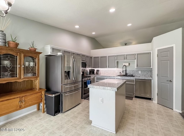 602 Tamsen Rd, Fernley, NV 89408 - kitchen with appliances with stainless steel finishes, gray cabinets, a sink, vaulted ceiling, and light floors