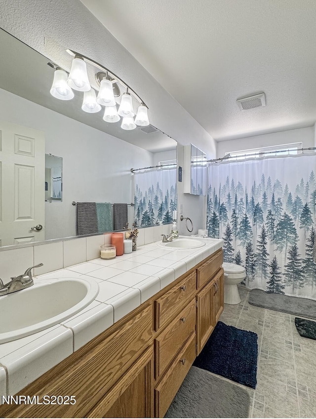 602 Tamsen Rd, Fernley, NV 89408 - full bath featuring double vanity, toilet, a shower with shower curtain, and a chandelier