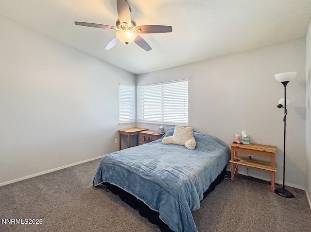 602 Tamsen Rd, Fernley, NV 89408 - carpeted bedroom with vaulted ceiling, baseboards, and a ceiling fan