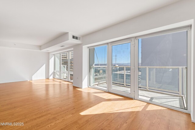 255 N Sierra St Unit 1210, Reno, NV 89501 - spare room featuring wood finished floors