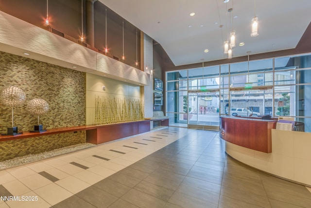 255 N Sierra St Unit 1210, Reno, NV 89501 - reception featuring a towering ceiling and expansive windows
