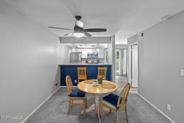 423 Barclay Ct, Reno, NV 89511 - dining area featuring baseboards, a ceiling fan, and carpet flooring