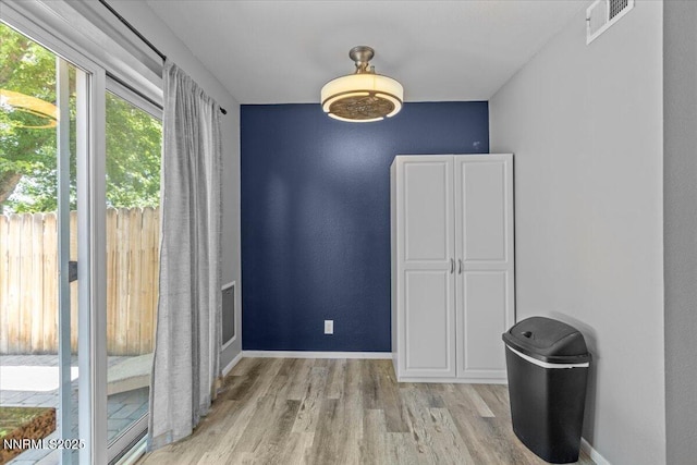 423 Barclay Ct, Reno, NV 89511 - unfurnished dining area with light wood finished floors and baseboards