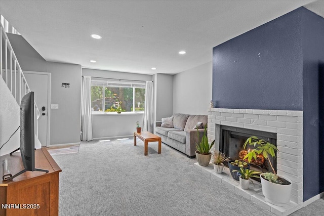 423 Barclay Ct, Reno, NV 89511 - living room featuring carpet floors, recessed lighting, a brick fireplace, and baseboards