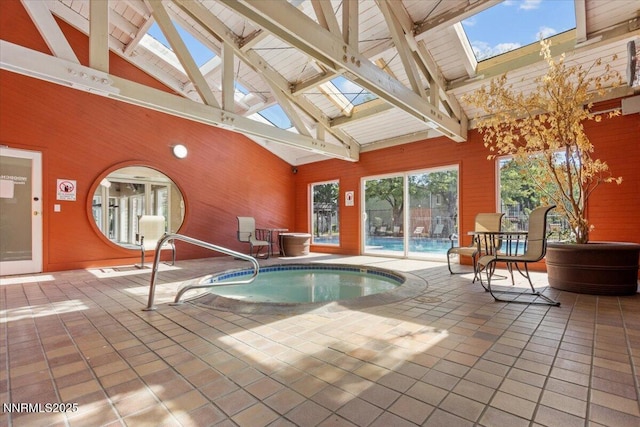 423 Barclay Ct, Reno, NV 89511 - indoor pool featuring a skylight and an in-ground hot tub