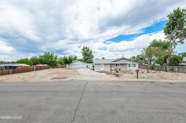 9365 Gremlin Way, Reno, NV 89506 - view of front of property featuring a detached garage and an outbuilding