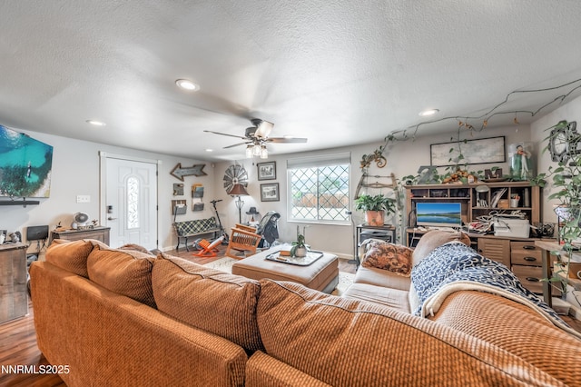 9365 Gremlin Way, Reno, NV 89506 - living room featuring wood finished floors, ceiling fan, recessed lighting, and a textured ceiling