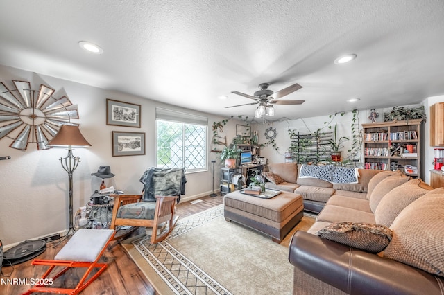 9365 Gremlin Way, Reno, NV 89506 - living area featuring wood finished floors, a ceiling fan, recessed lighting, a textured ceiling, and baseboards