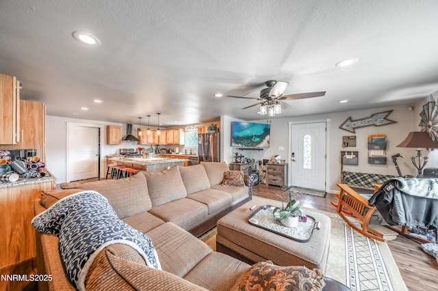9365 Gremlin Way, Reno, NV 89506 - living room with light wood-style floors, recessed lighting, and ceiling fan