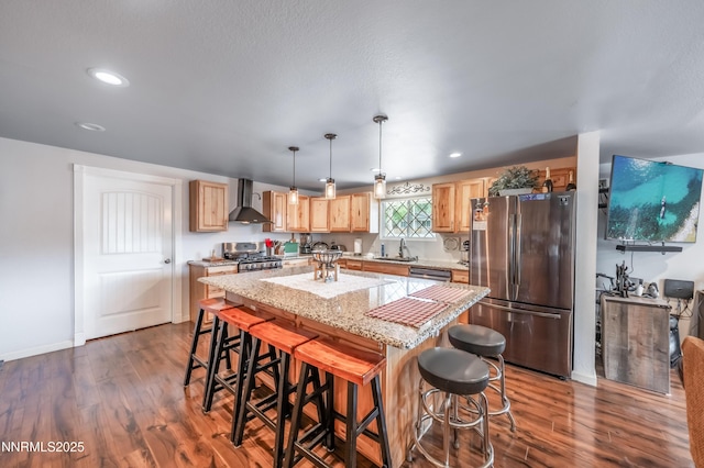 9365 Gremlin Way, Reno, NV 89506 - kitchen with stainless steel appliances, wall chimney exhaust hood, a sink, dark wood finished floors, and recessed lighting