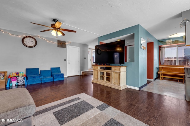 7090 Peppermint Dr, Reno, NV 89506 - living area featuring ceiling fan, wood finished floors, baseboards, and a textured ceiling