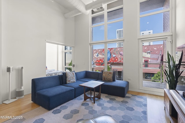 255 N Sierra St Unit 305, Reno, NV 89501 - living area featuring a towering ceiling and wood finished floors