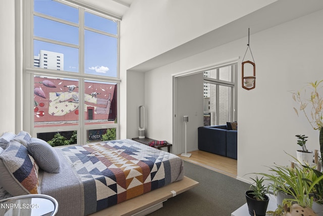 255 N Sierra St Unit 305, Reno, NV 89501 - bedroom featuring a towering ceiling and wood finished floors