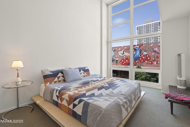 255 N Sierra St Unit 305, Reno, NV 89501 - carpeted bedroom with a towering ceiling and baseboards