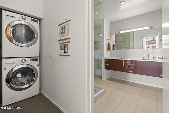 255 N Sierra St Unit 305, Reno, NV 89501 - washroom with stacked washing machine and dryer, light tile patterned floors, and recessed lighting