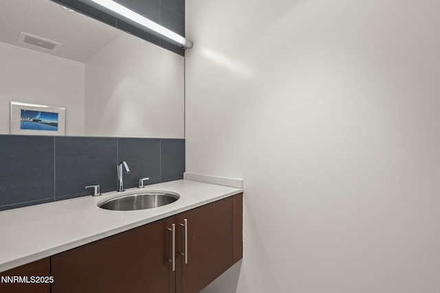 255 N Sierra St Unit 305, Reno, NV 89501 - bathroom with vanity and decorative backsplash