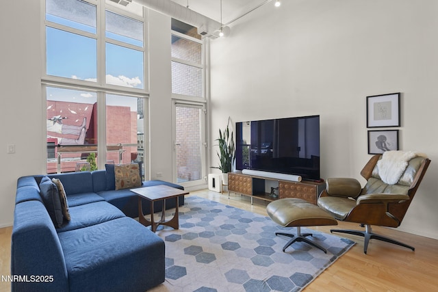 255 N Sierra St Unit 305, Reno, NV 89501 - living room with a high ceiling and wood finished floors